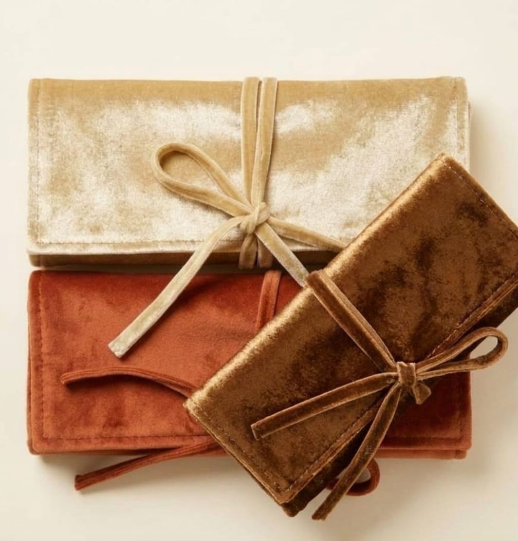Velvet jewellery rolls in champagne, rust and bronze